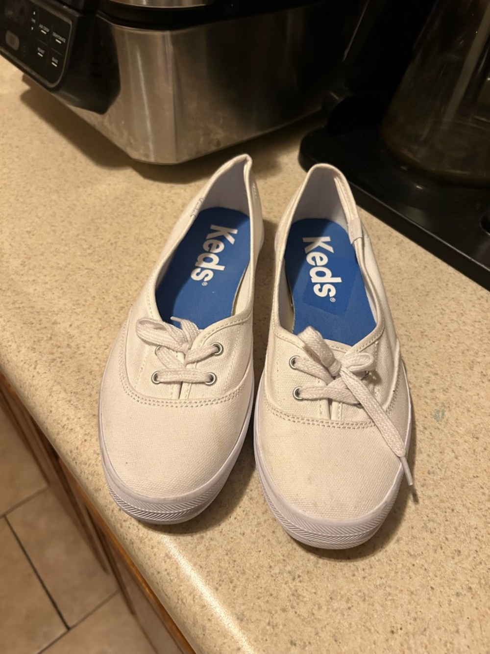 Keds White Canvas Slip-On Style Sneakers with Blue Insole